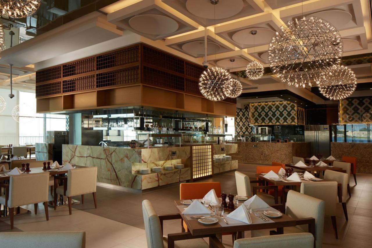 Royal M Hotel Abu Dhabi By Gewan Bagian luar foto The restaurant